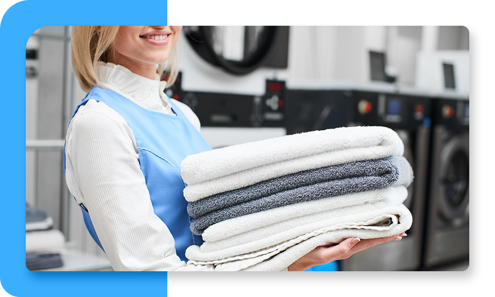 Woman holding folded towels